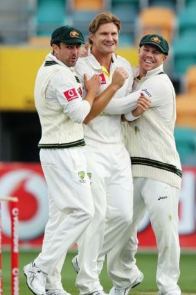 Shane Watson (centre) is congratulated by openers Ed Cowan (left) and David Warner.