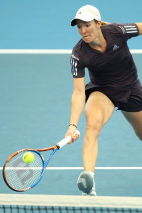 Relaxed...Justine Henin stretches for a forehand during her Brisbane International semi-final win over Ana Ivanovic.