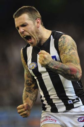 The new breed: Dane Swan celebrates a goal in the decisive fourth quarter of Friday's nail-biting final.