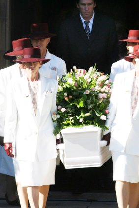 Jane McGrath's coffin leaves the church.
