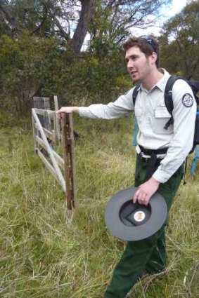 Ranger Mark Elford opens a gate along The Settlers Track