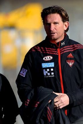 Football only: Essendon coach James Hird, pictured at training on Friday, deferred to the Bombers' administrative bosses on the peptides issue.