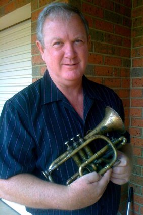 Peter Nelson holds his 31st Battalion cornet. It will be played at today's reburial ceremony.