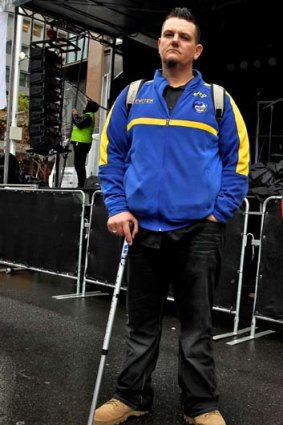 Construction worker Tom Rigby, who lost a leg after a construction accident, turns out for the protest against changes to the state's WorkCover scheme.