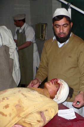 A Pakistani paramedic treats an injured blast victim at a hospital in Bannu district which borders Waziristan.