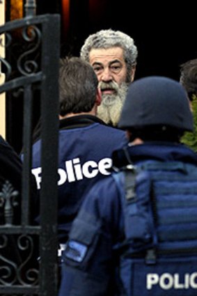 Police confront patriarch Macchour Chaouk.