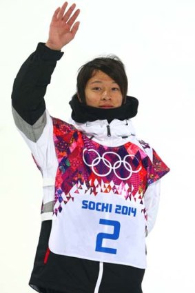 On the podium: Ayumu Hirano waves to the crowd.