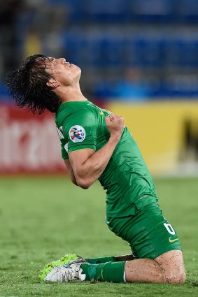 Zhang Xiaobin of Beijing Guoan celebrates the win.