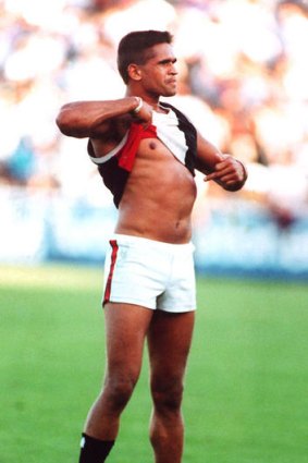 The moment: Nicky Winmar defiantly points to his skin.