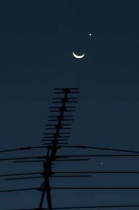 Celestial: The moon with Jupiter below and Venus above in 2005.