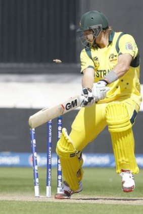 Australia's Shane Watson looks at the bails as he is bowled by India's Ishant Sharma.