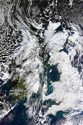 A satellite image shows Britain covered in snow.  Widespread ice and sub-zero temperatures continue to cause disruption across the UK.