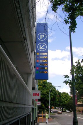 A sign showing vacant car spaces.