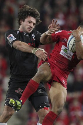 Will Genia, right, clashes with Ryan Kankowski of the Sharks last Saturday night.