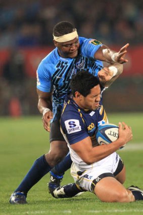 Brumbies winger Joe Tomane cleans up possession.