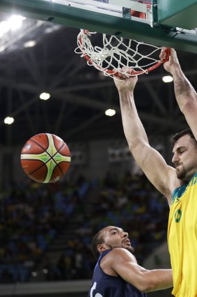 Slam: Australia's Australia's Andrew Bogut, right, dunks the ball.