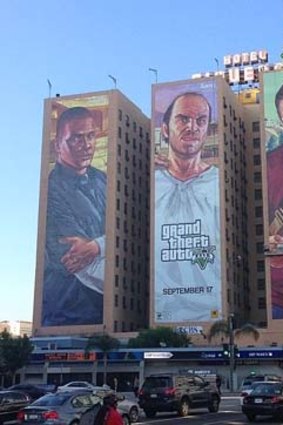 Enormous posters for Grand Theft Auto V hang from the Figueroa Hotel in downtown LA.