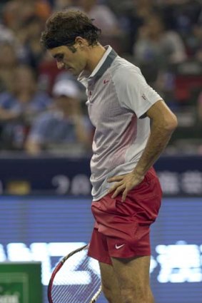 Down, not out: Roger Federer reflects at the Shanghai Masters.