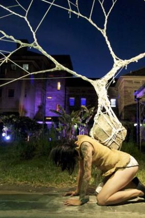 String sculpture by Garth Knight, with the performer Lian Loke.