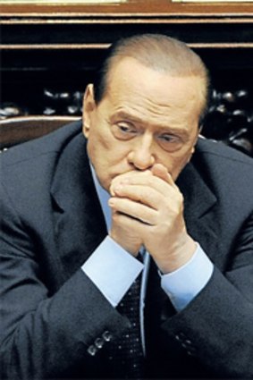 Italy’s Prime Minister, Silvio Berlusconi, sits in parliament.
