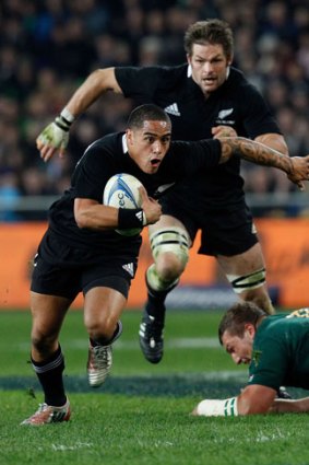 Game buster: All Blacks half-back Aaron Smith heads to the tryline to break South African hearts last night.