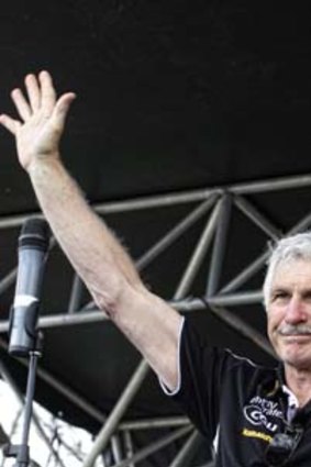 Outgoing Magpies coach Mick Malthouse acknowledges the cheers from supporters the day after the 2011 grand final loss.