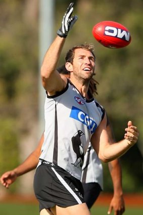 Handy type: Collingwood star Travis Cloke is set to play despite dislocating his finger.