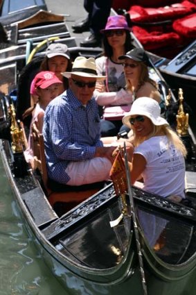Family holiday ... Rupert Murdoch takes his wife, Wendi, top, and children Grace and Chloe, left, on a gondola ride in Venice.