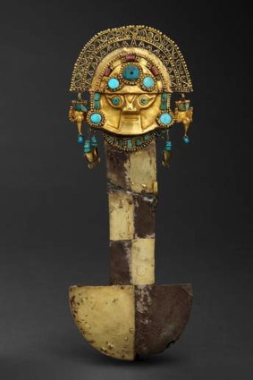 A tumi, or sacrificial knife, made of gold and silver, decorated with chrysocolla turquoise and lapis lazuli.