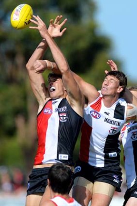 Justin  Koschitzke spoils Tom Hickey during a Saints' intra-club game in February.