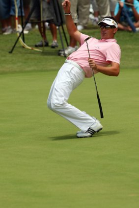 Robert Allenby wills his putt along at the fifth hole.