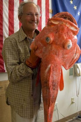 Sport fisherman Henry Liebman, from Seattle, holds his record-breaking shortraker rockfish at the Alaska Department of Fish and Game office.