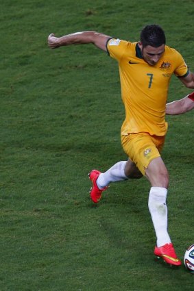 On the run: Matthew Leckie takes on Chile's Charles Eugenio Mena in Australia's opening World Cup match.