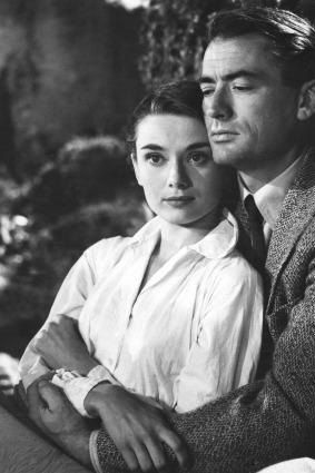 Audrey Hepburn as Anne, a young European princess who finds romance with reporter Joe Bradley (Gregory Peck) in <i>Roman Holiday</i>.