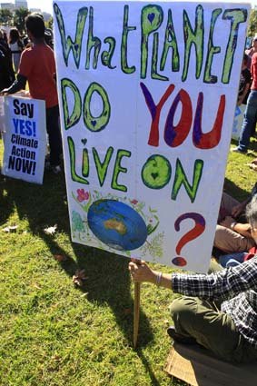 Supporters of the federal government controversial carbon tax gather at a rally in Sydney.