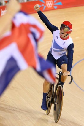 Sir Chris Hoy of Great Britain celebrates after setting a new world record and winning gold.
