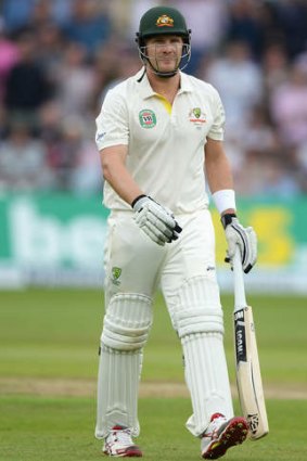 Shane Watson of Australia walks back to the pavilion after being dismissed for 13.
