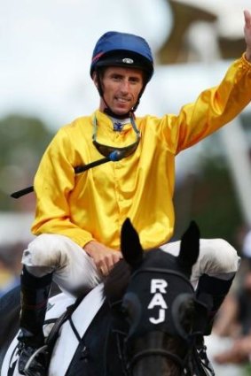 Nash Rawiller salutes after victory in the BMW on Silent Achiever.