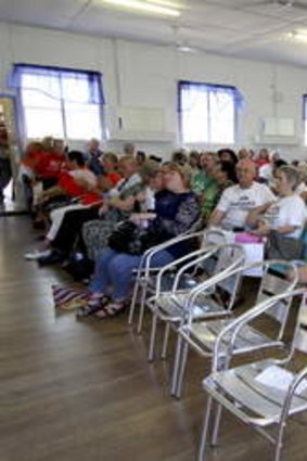 Redcliffe residents listen to candidates speak ahead of next week's state byelection.