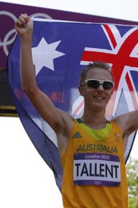 Canberra's Jared Tallent celebrates with the Australian flag after claiming silver in the men's 50km race walk during the London 2012 Olympic Games.