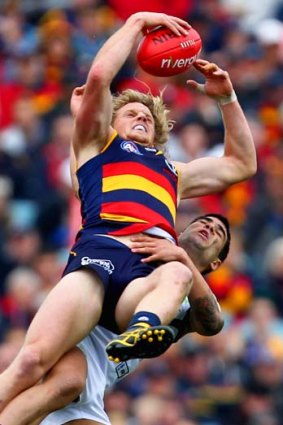 Crow Rory Sloane grabs a mark over Clancee Pearce of the Dockers. Adelaide has the easiest final home-and-away match among the top six on the ladder.