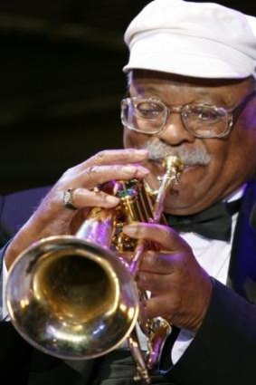 Jazz musician Clark Terry performs to celebrate the 20th anniversary of the Thelonious Monk Institute of Jazz in the East Room of the White House in 2006. 