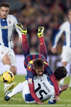 Ball and all: FC Barcelona's Neymar is tackled by Espanyol's Hector Moreno.