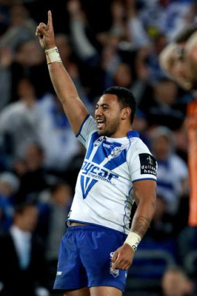 Match-winner ... Krisnan Inu of the Bulldogs celebrates kicking the winning field-goal in extra time against Wests Tigers.