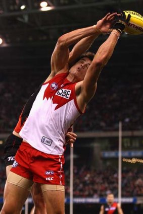 That's mine: Mike Pyke of the Swans marks in a match against Essendon last month.