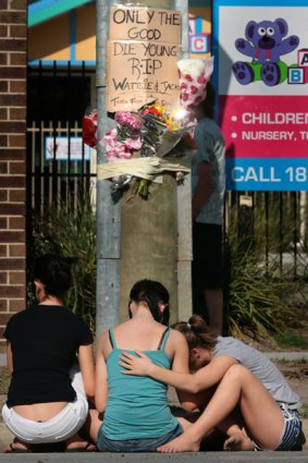 Grief-stricken teenagers  at the site of the fatal crash in Carrum Downs.