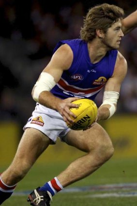 Dog gone?: The Bulldogs' Callan Ward is grappling with a multimillion-dollar dilemma - stay at Whitten Oval or head to Greater Western Sydney.