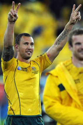 Wallabies fly-half Quade Cooper celebrates after winning the Rugby World Cup quarter-final match against South Africa.