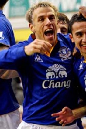 Glory days: Tim Cahill (centre) celebrates a goal with Phil Neville during one of his 278 games for Everton.