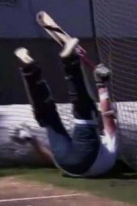 Danger zone: Piers Morgan falls to the ground during a batting contest with Brett Lee.